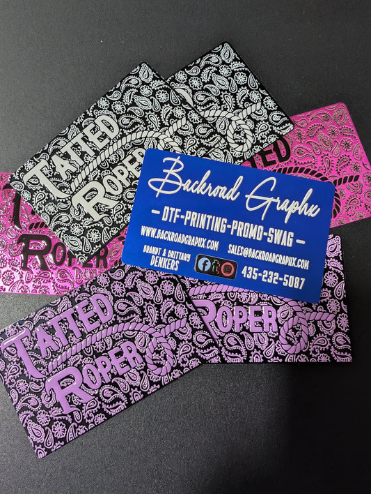 Colorful bandana-style business cards with 'Backroad Graphics' branding on a black background.